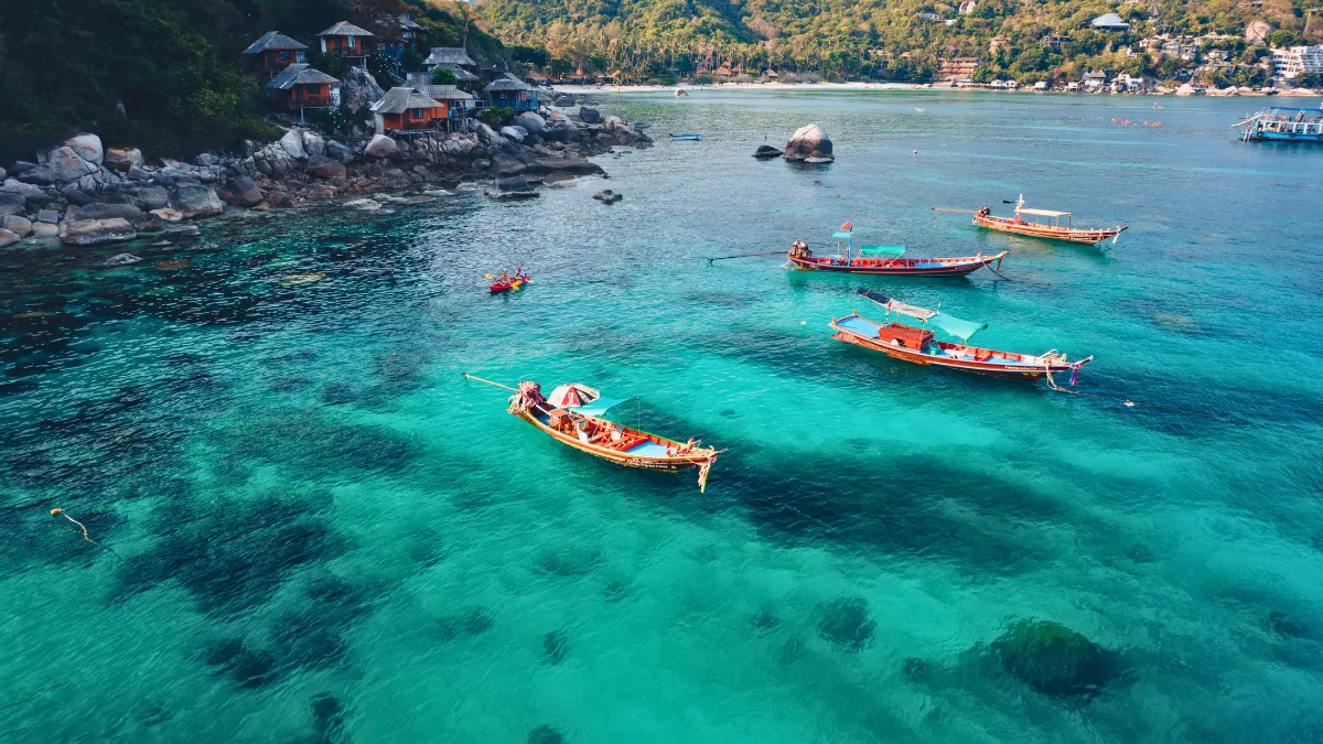 Island and Boat in Clear Sea at Koh Tao Island and Boat in Clear Sea at Koh Tao