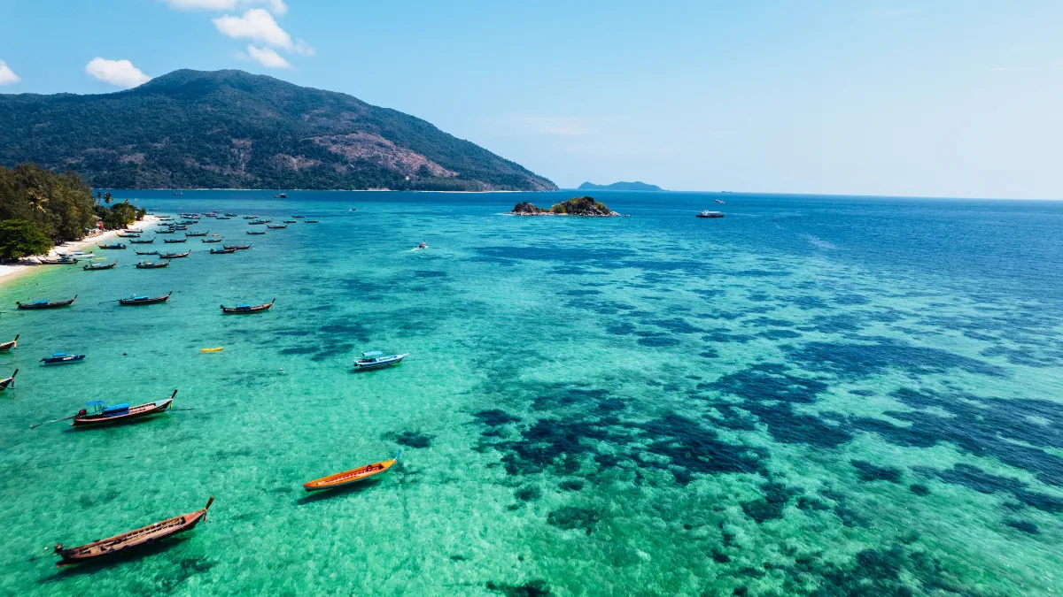Longtail Boats and Beach at Koh Lipe Longtail Boats and Beach at Koh Lipe