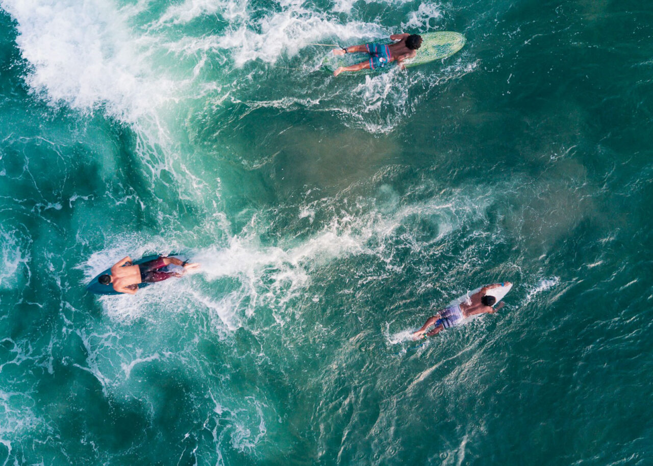 surfers-bali-1280x914-1 Drone shot of surfers on the water in Bali